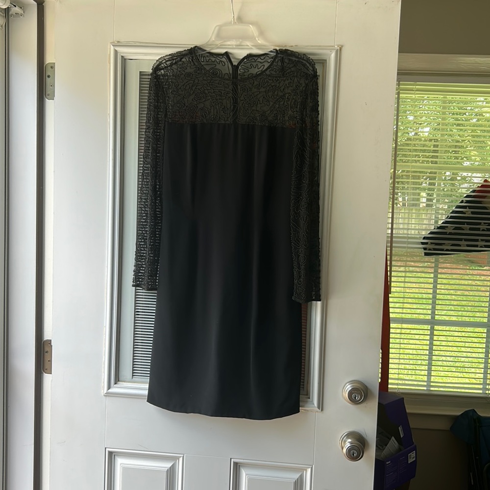 Black fully lined dress with beaded designer sleeves and décolleté